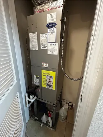 a view of living room with furniture and a window