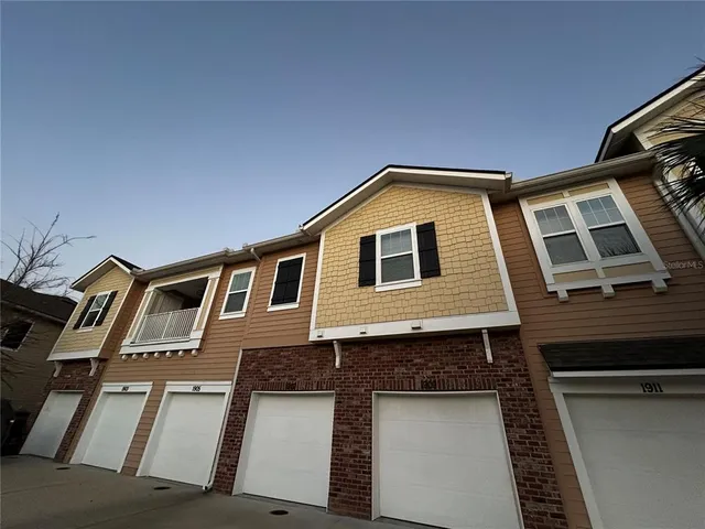 a front view of a house with a garage
