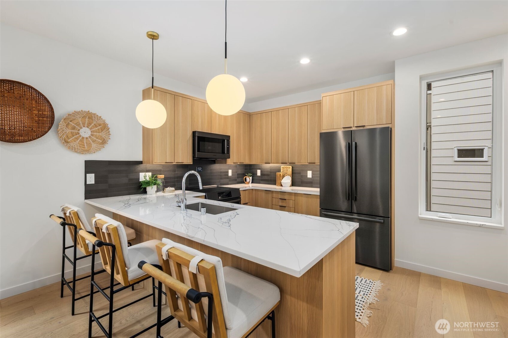 4123 B Chilberg Avenue Southwest Seattle, WA 98116 - Photo 12 of 25 a kitchen with a table chairs and a refrigerator
