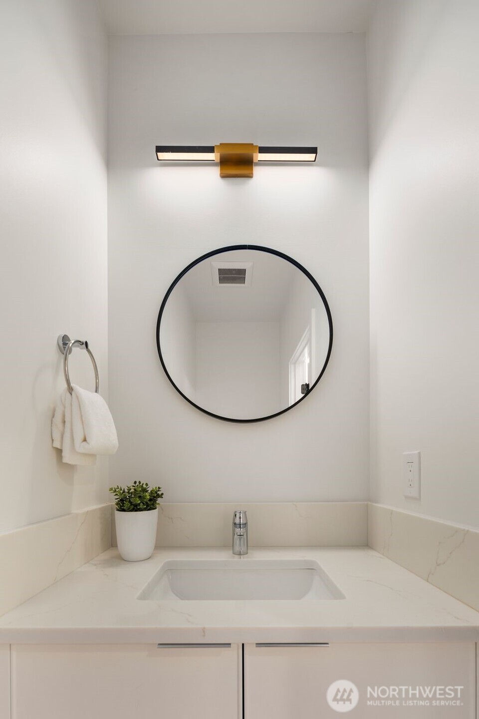 4123 B Chilberg Avenue Southwest Seattle, WA 98116 - Photo 13 of 25 a bathroom with a sink and mirror