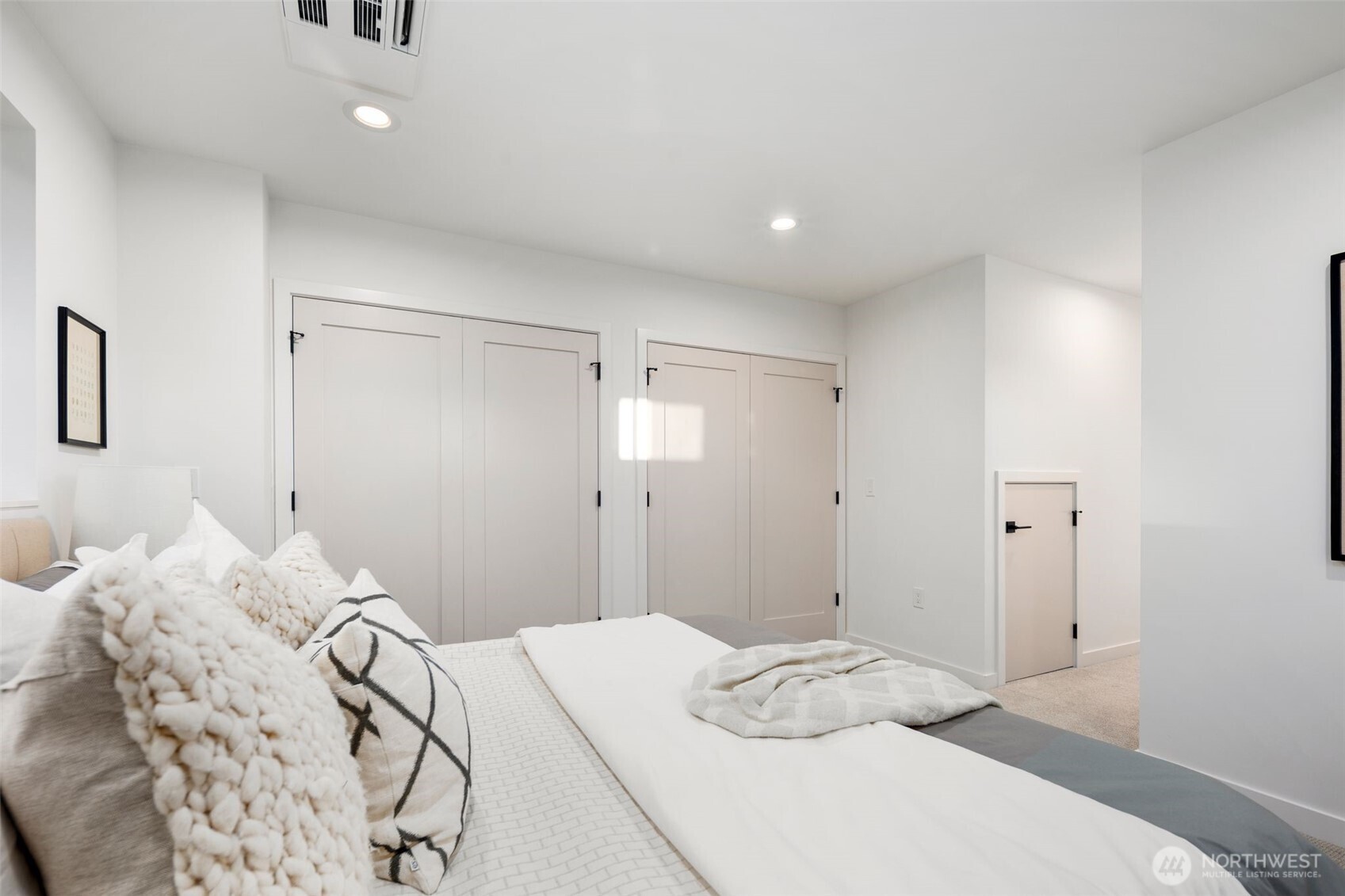 4123 B Chilberg Avenue Southwest Seattle, WA 98116 - Photo 16 of 25 a bedroom with a bed and a bathroom