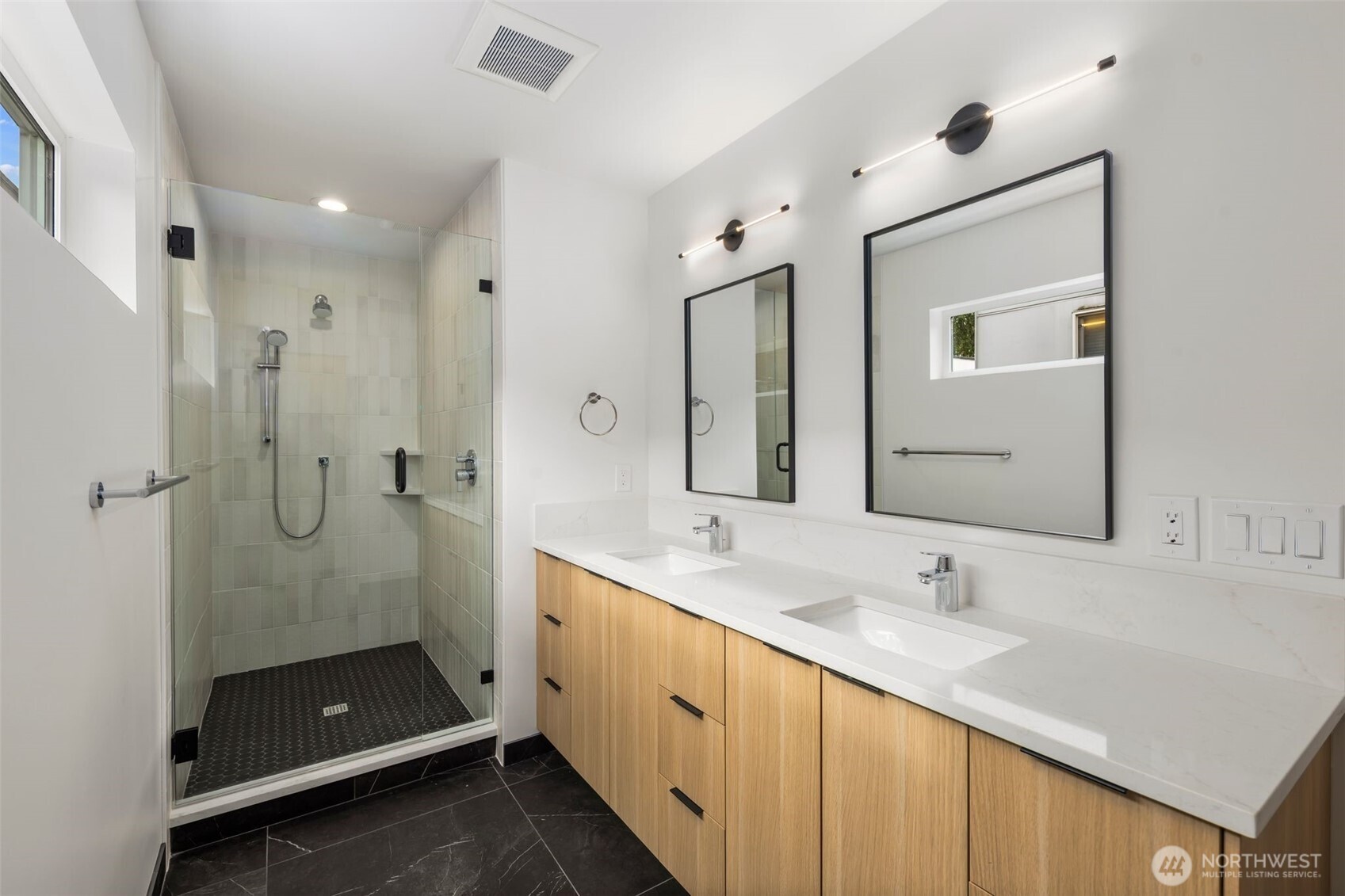 4123 B Chilberg Avenue Southwest Seattle, WA 98116 - Photo 17 of 25 a bathroom with a double vanity sink shower and mirror