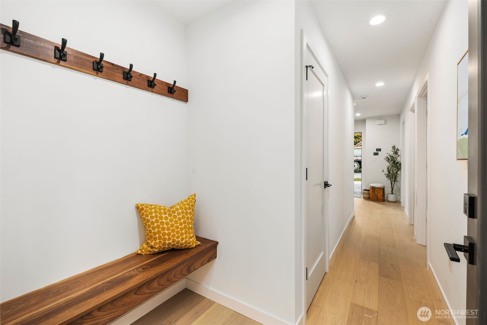 4123 B Chilberg Avenue Southwest Seattle, WA 98116 - Photo 2 of 25 a view of a hallway with stairs and wooden floor