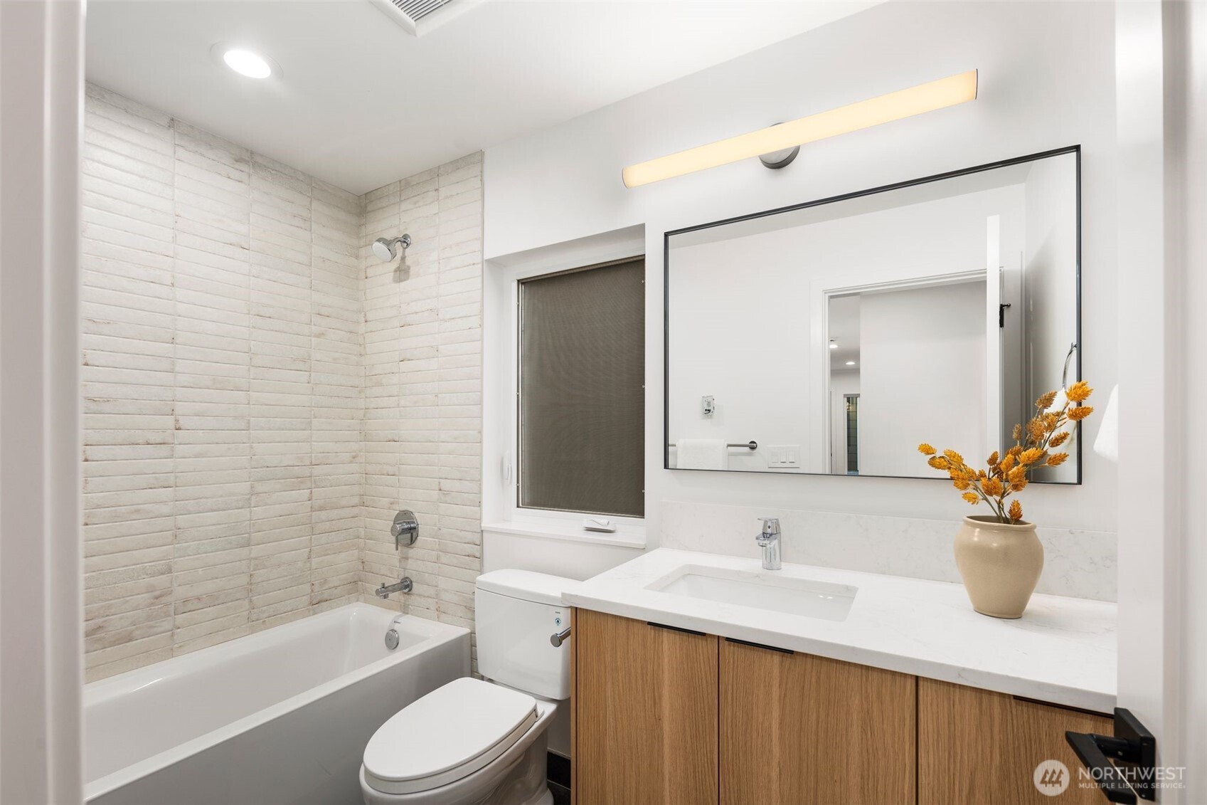 4123 B Chilberg Avenue Southwest Seattle, WA 98116 - Photo 23 of 25 a bathroom with a sink toilet a mirror and shower