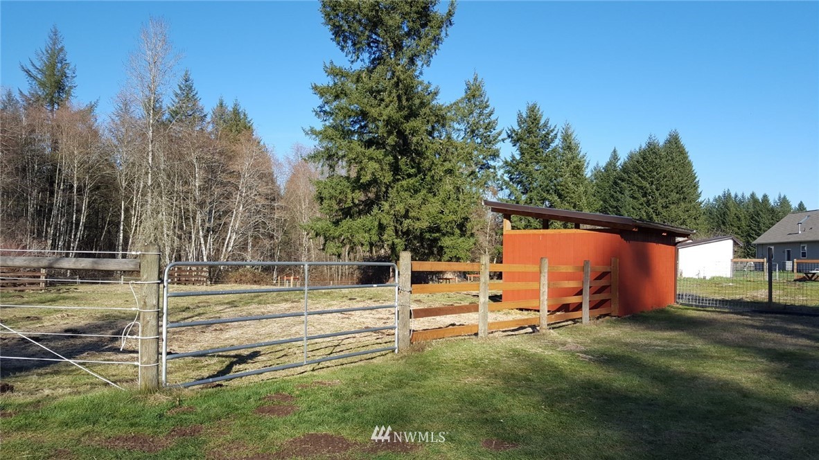 5709 140th Avenue Southwest Rochester, WA 98579 - Photo 22 of 24 a view of backyard with deck and backyard
