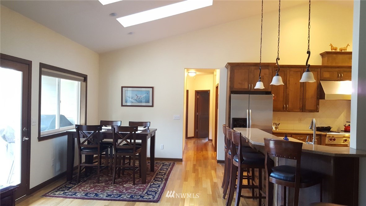 5709 140th Avenue Southwest Rochester, WA 98579 - Photo 8 of 24 a view of a dining room with furniture