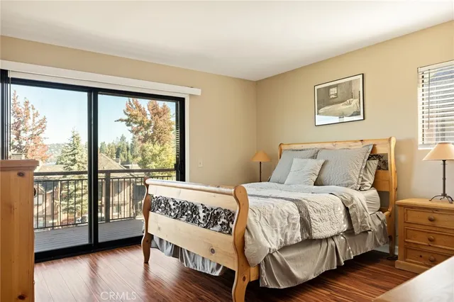 a bedroom with a large bed and a large window