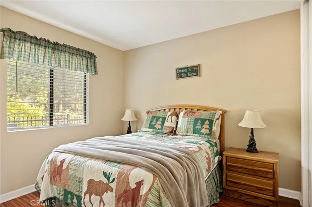 a bedroom with a bed and a lamp