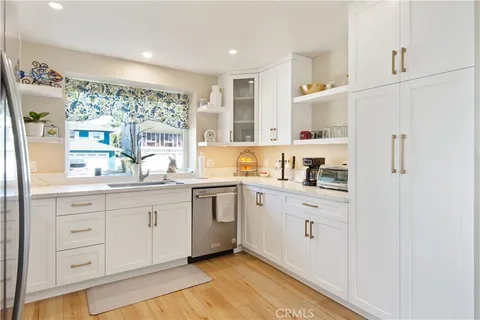 a spacious bathroom with a granite countertop sink mirror and a bathtub