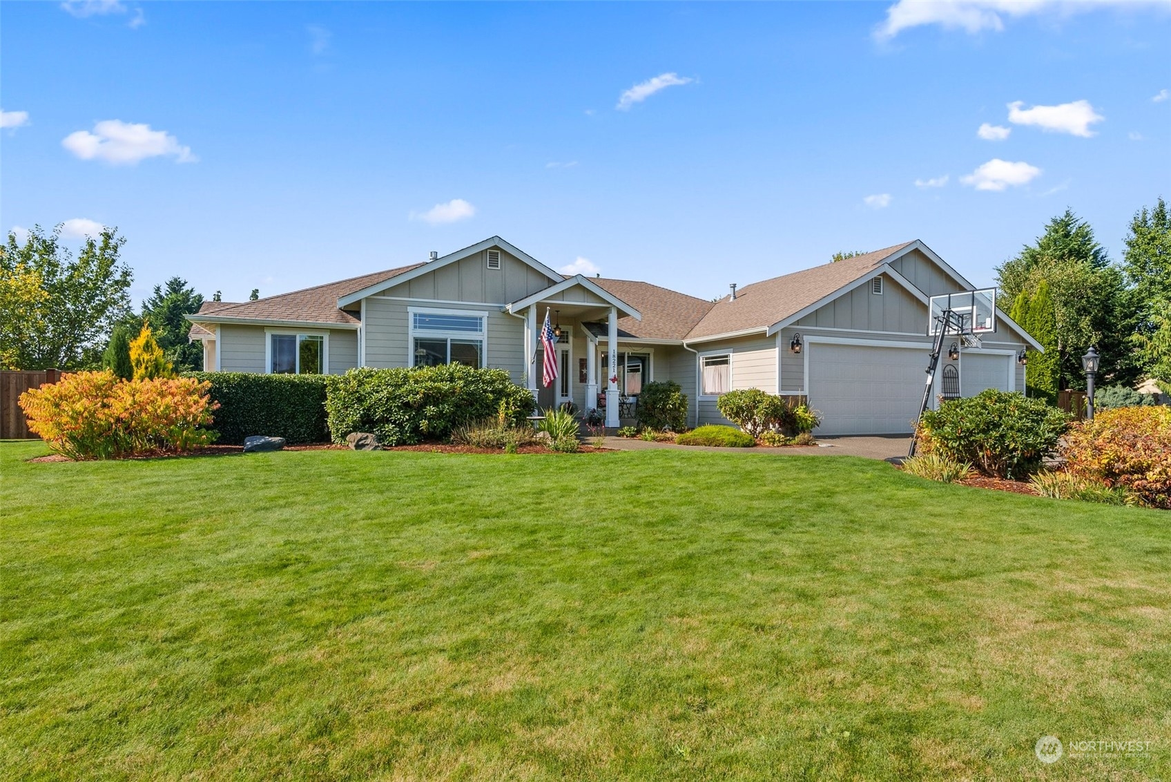 18221 Joseph Drive Southwest Rochester, WA 98579 - Photo 3 of 40 a front view of a house with a garden and yard