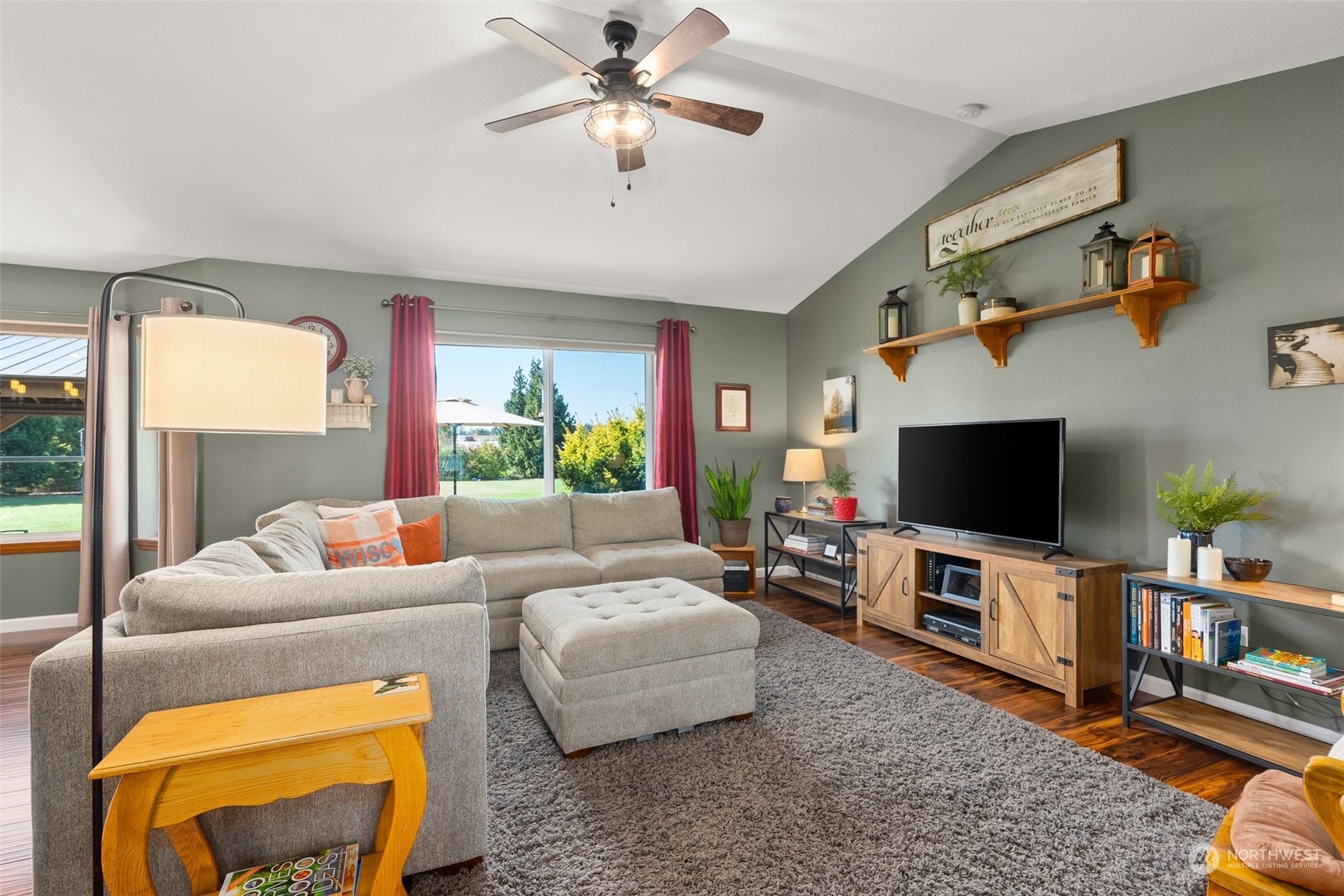 18221 Joseph Drive Southwest Rochester, WA 98579 - Photo 8 of 40 a living room with furniture and a flat screen tv