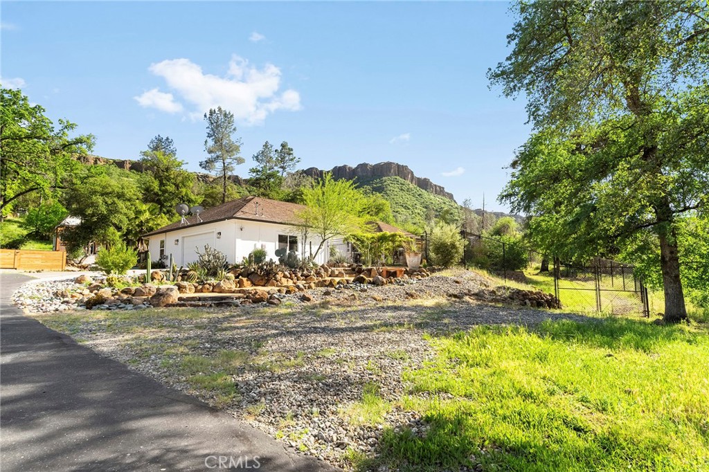 2262 Honey Run Road Chico, CA 95928 - Photo 2 of 74 a view of a big yard with plants and large trees