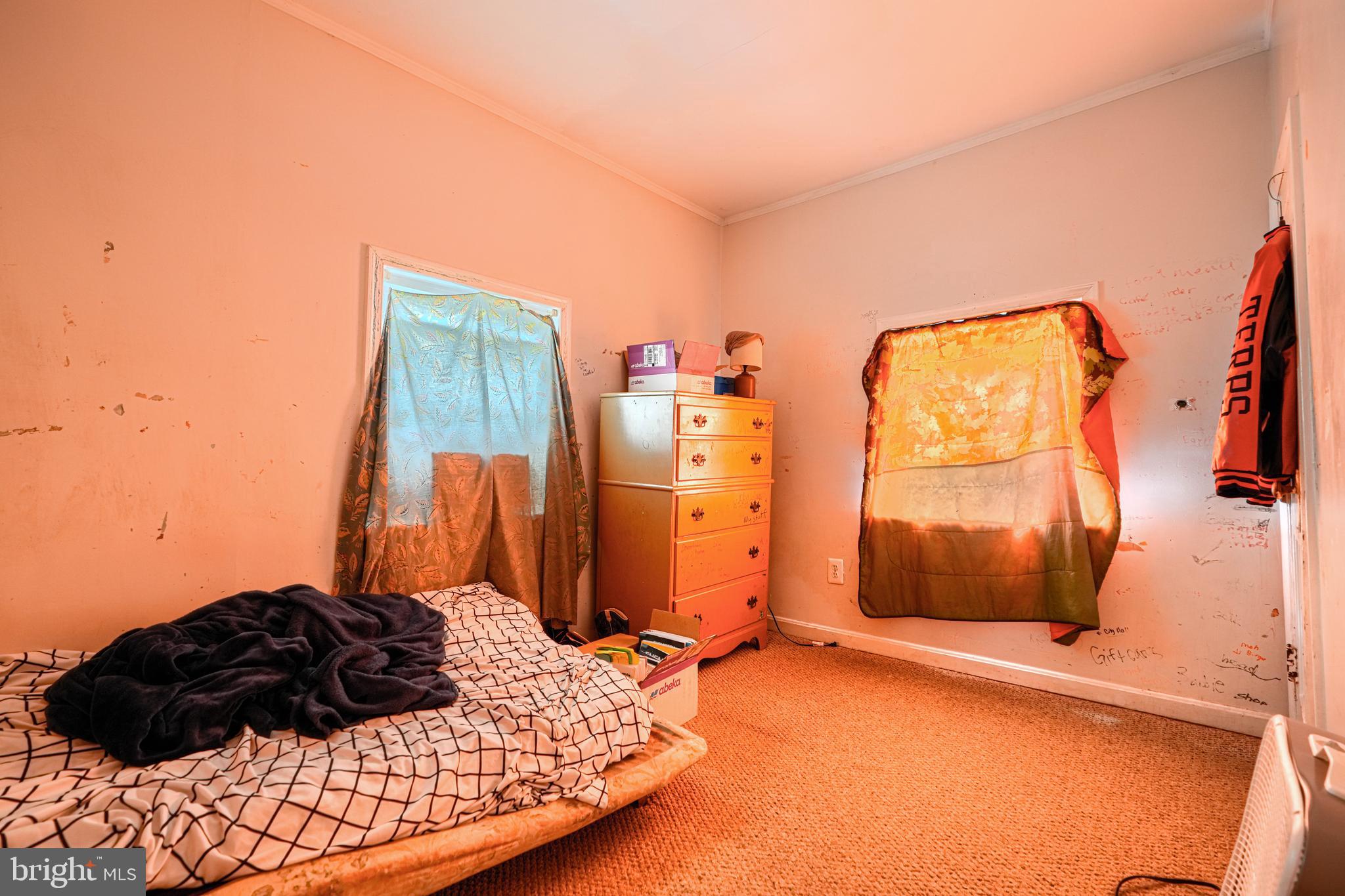 502 Grovethorn Road Middle River, MD 21220 - Photo 12 of 20 a bedroom with a bed and a window