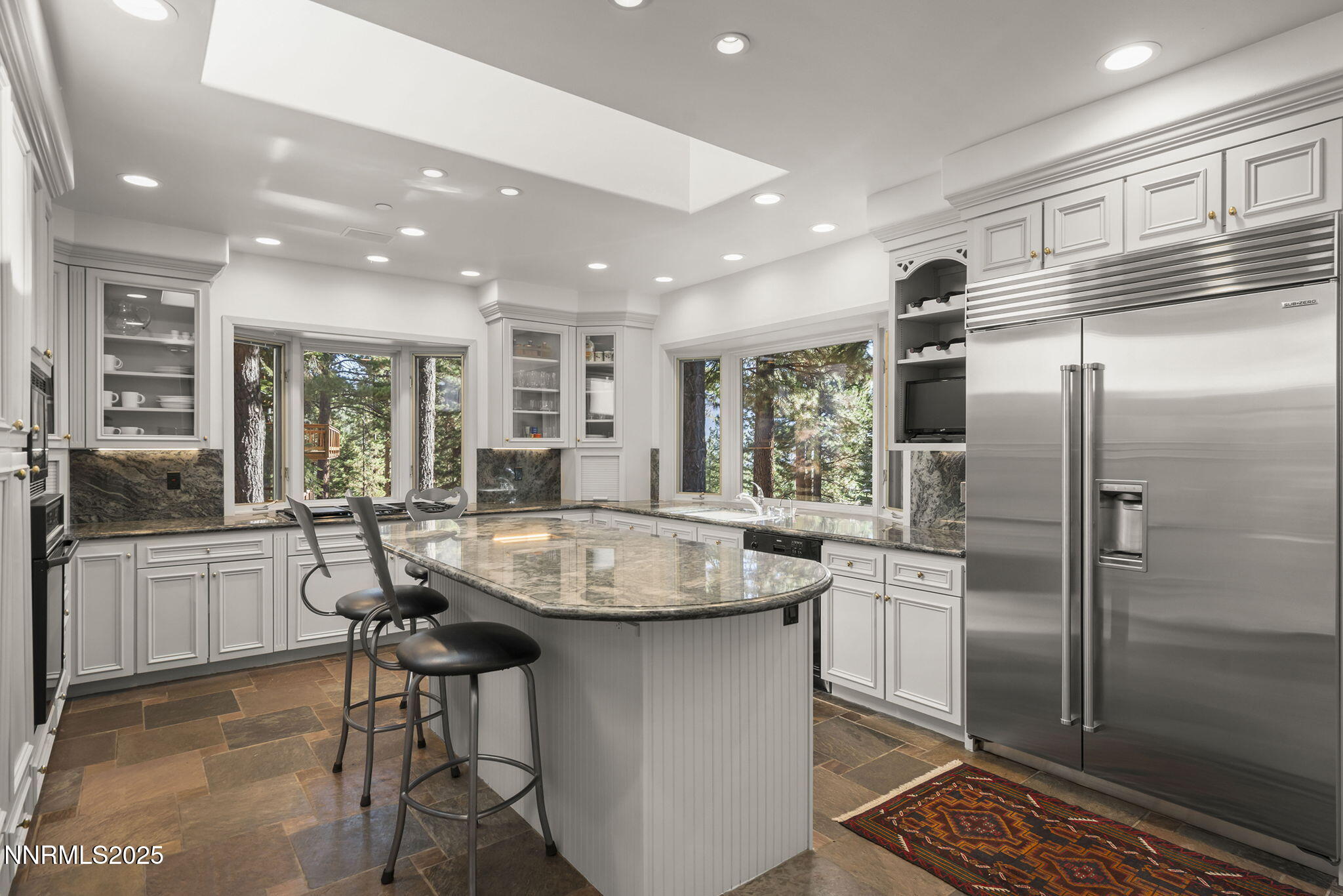 563 Tyner Way Incline Village, NV 89451 - Photo 14 of 42 a kitchen with stainless steel appliances granite countertop a sink and a refrigerator