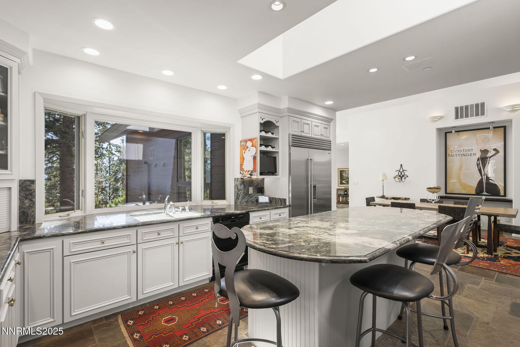 563 Tyner Way Incline Village, NV 89451 - Photo 16 of 42 a kitchen with sink and chairs
