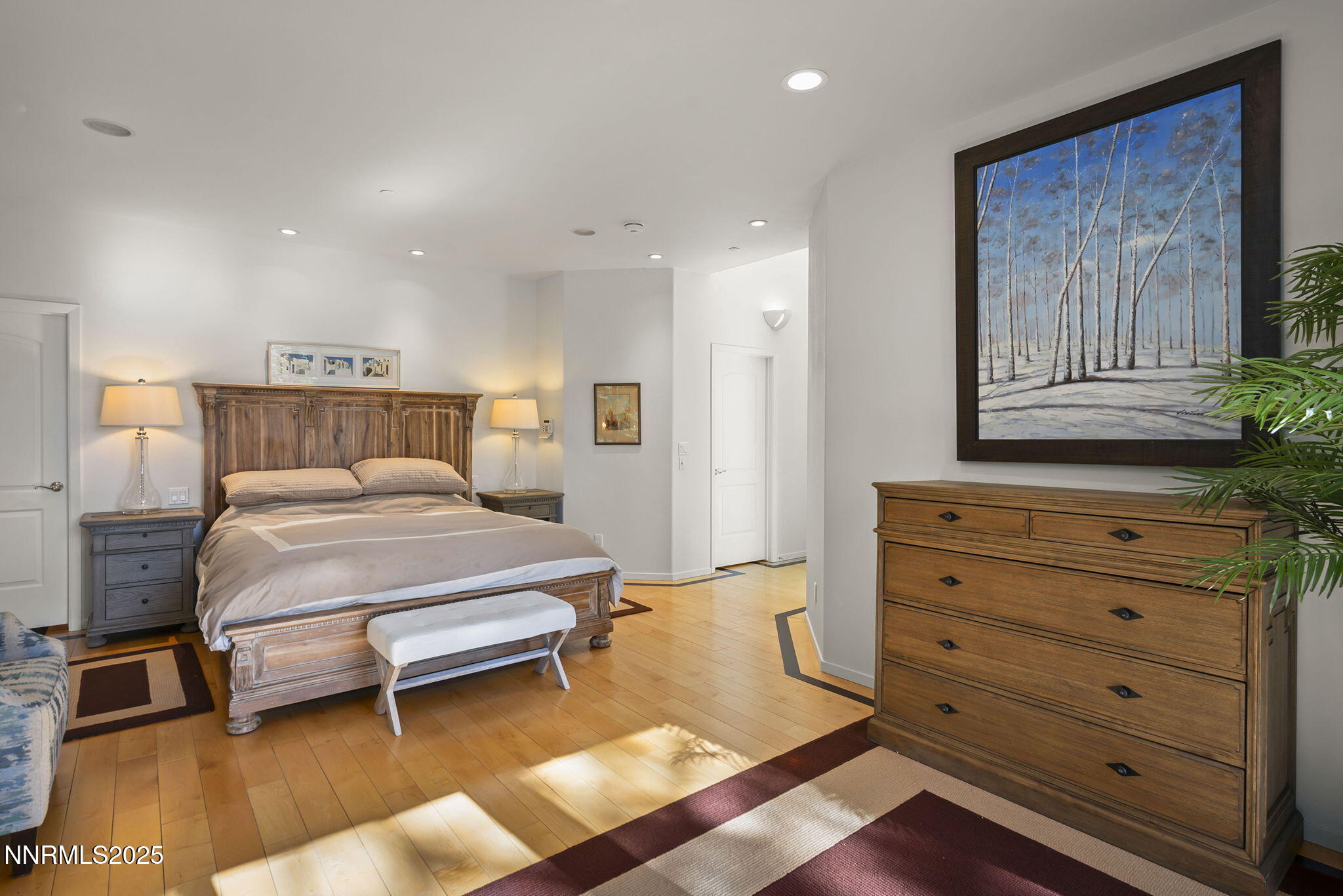 563 Tyner Way Incline Village, NV 89451 - Photo 18 of 42 a bedroom with a bed and a mirror