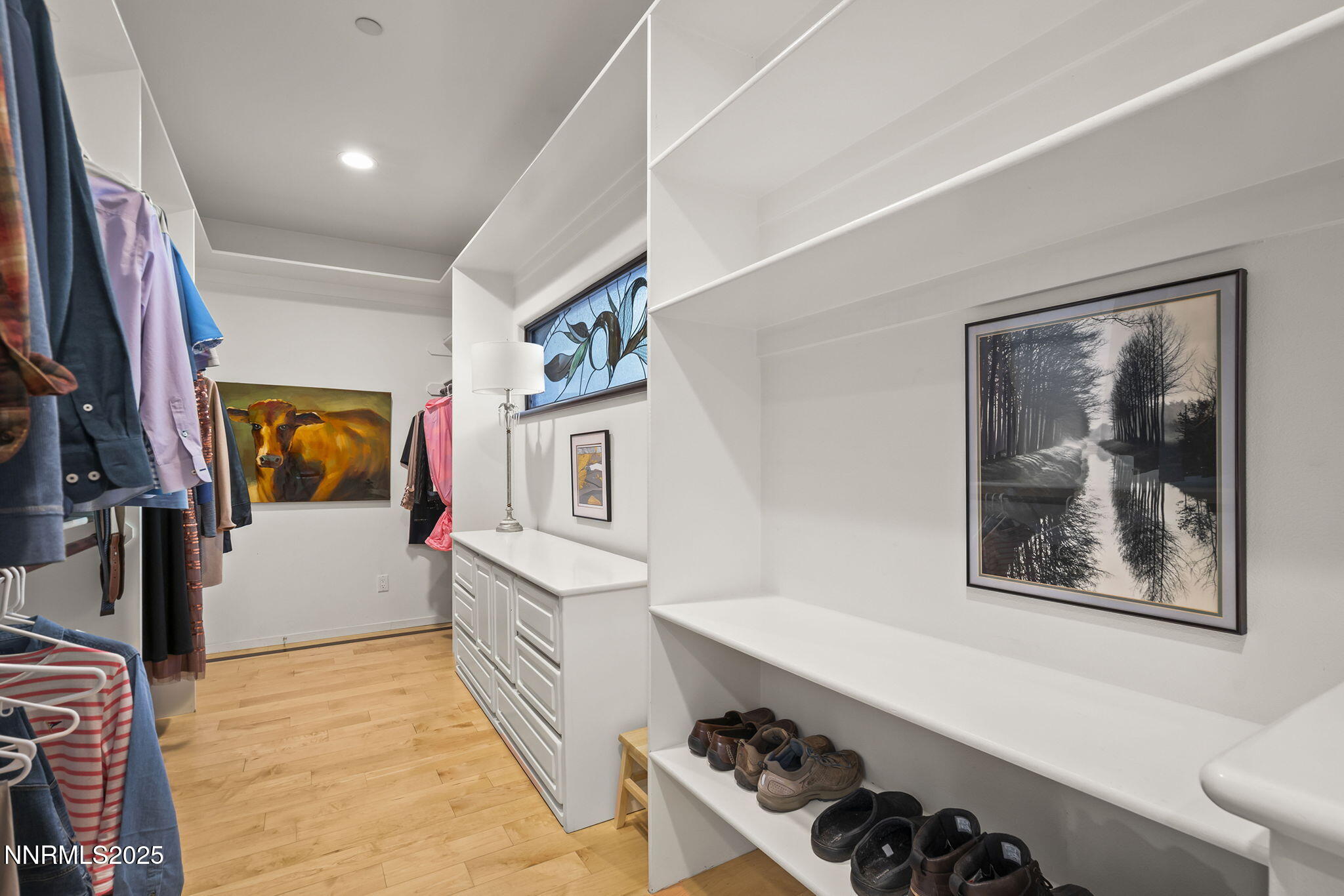 563 Tyner Way Incline Village, NV 89451 - Photo 22 of 42 a hallway with a painting on the wall and a window