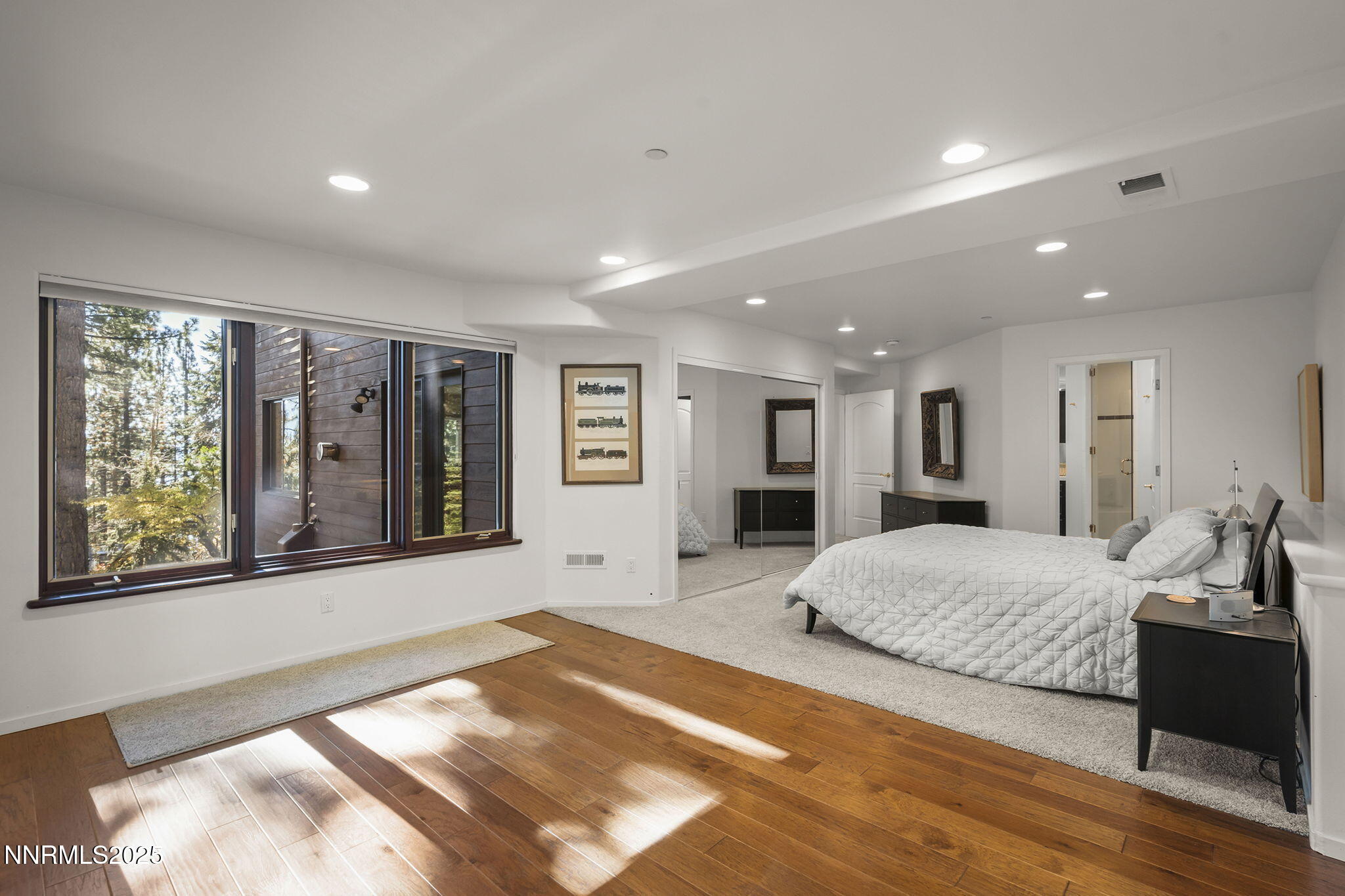 563 Tyner Way Incline Village, NV 89451 - Photo 28 of 42 a spacious bedroom with a large bed and a large window