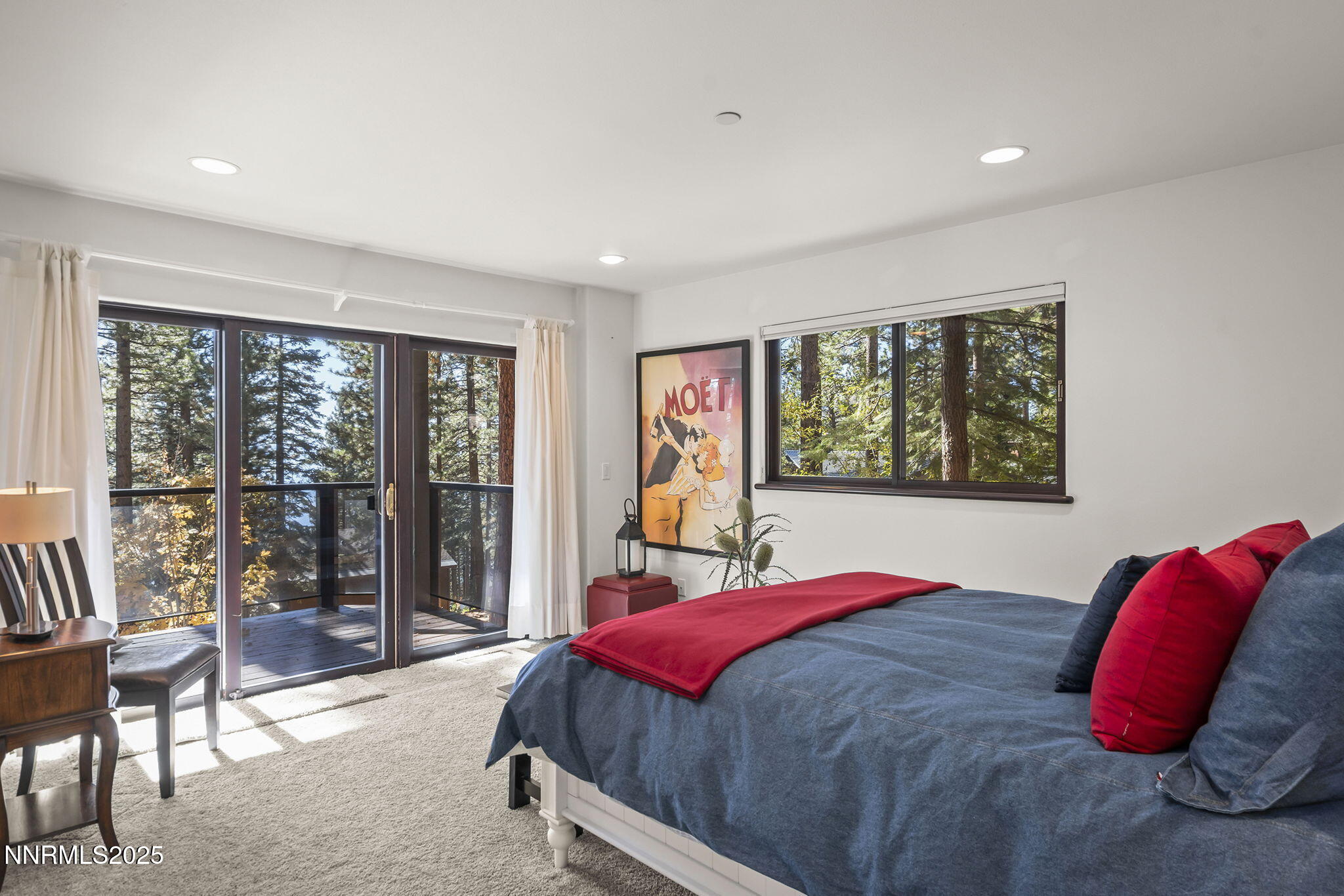 563 Tyner Way Incline Village, NV 89451 - Photo 30 of 42 a bedroom with a large bed and a large window