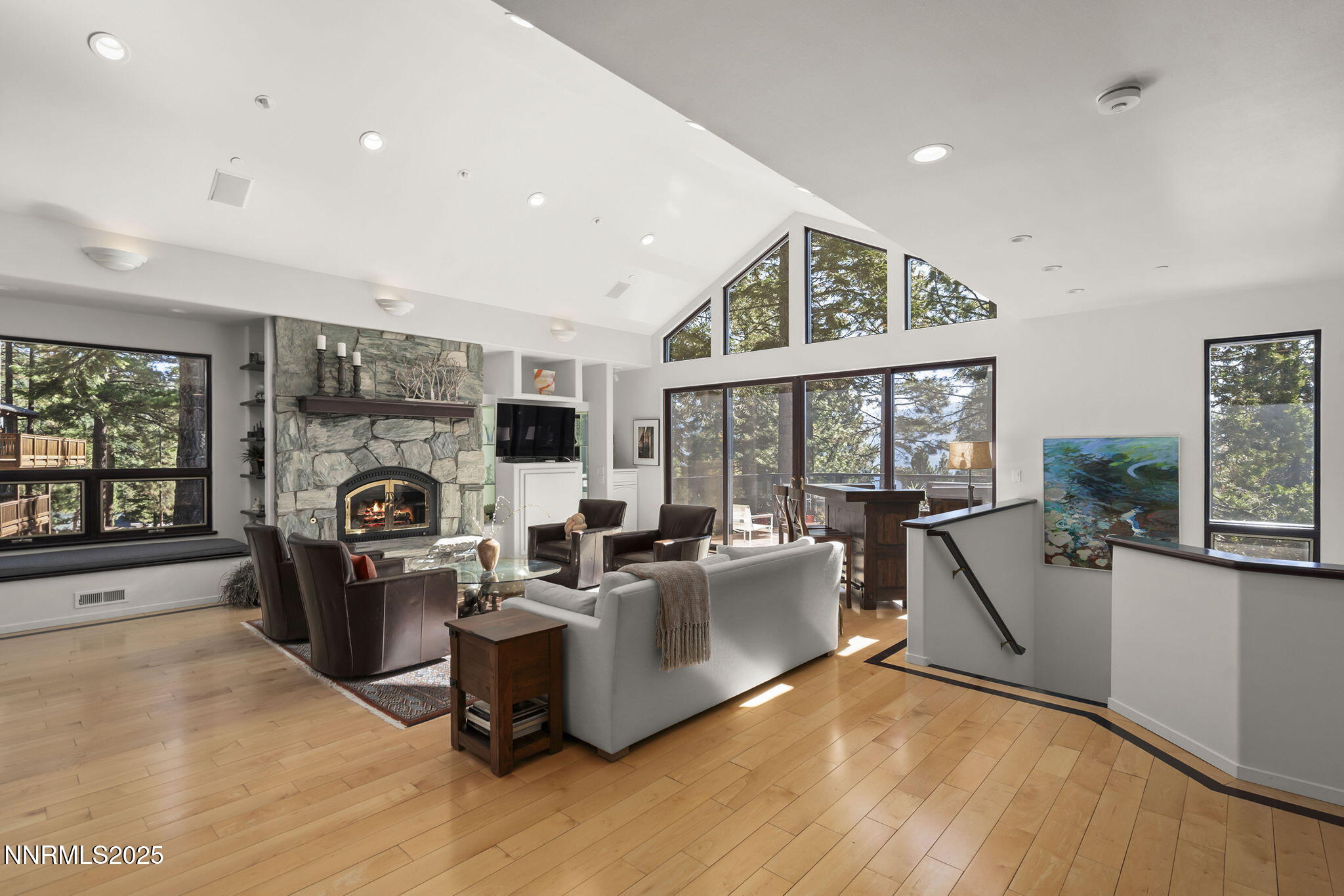 563 Tyner Way Incline Village, NV 89451 - Photo 3 of 42 a living room with furniture a flat screen tv and a floor to ceiling window