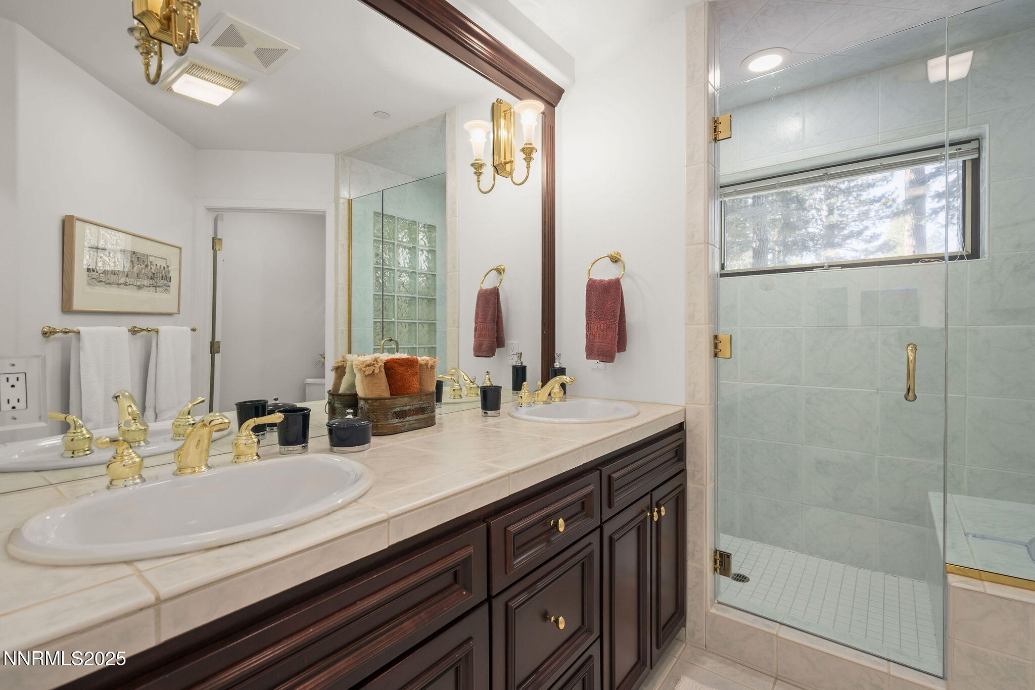 563 Tyner Way Incline Village, NV 89451 - Photo 32 of 42 a bathroom with double vanity sinks double vanity and a shower