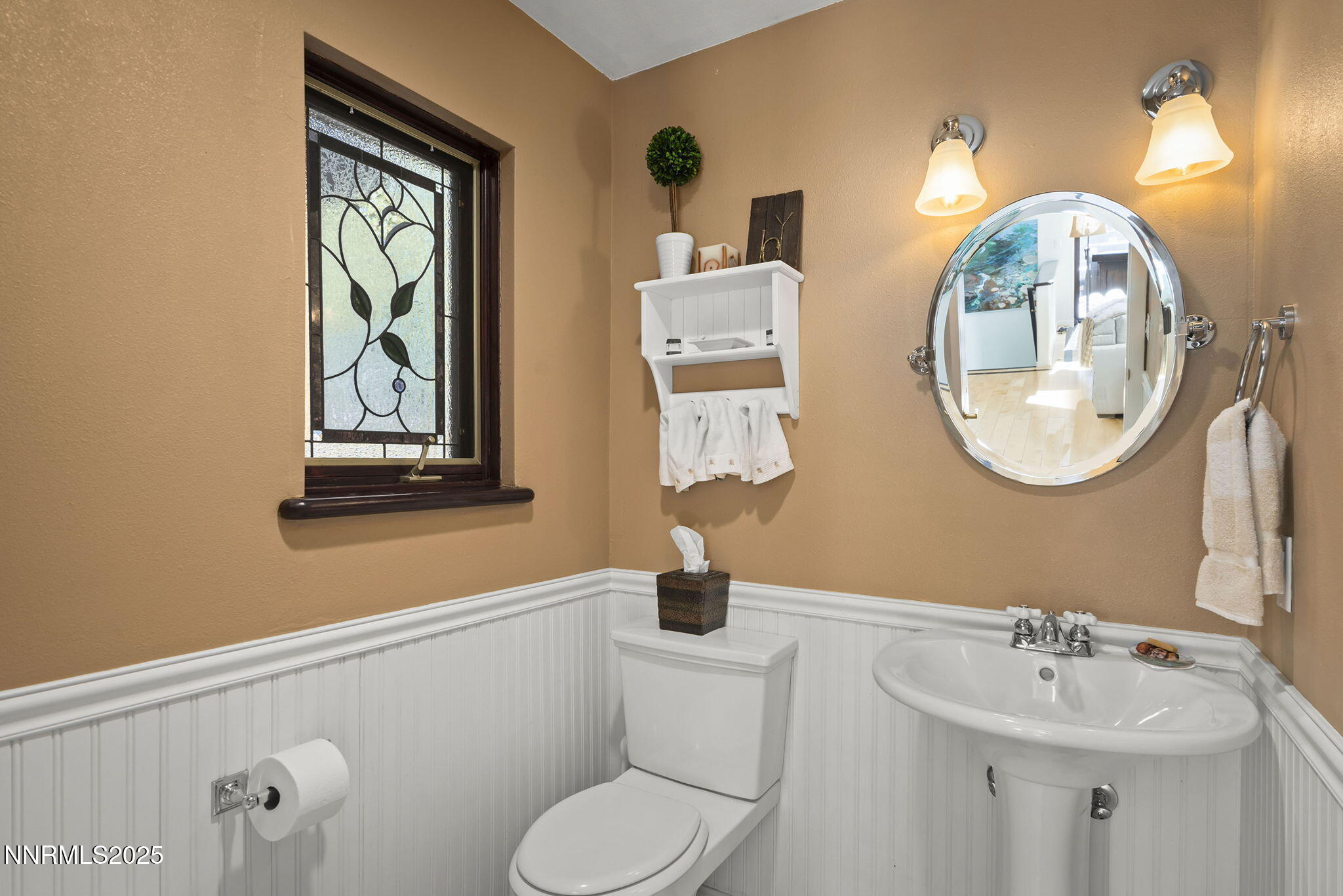 563 Tyner Way Incline Village, NV 89451 - Photo 37 of 42 a bathroom with a toilet a sink and mirror