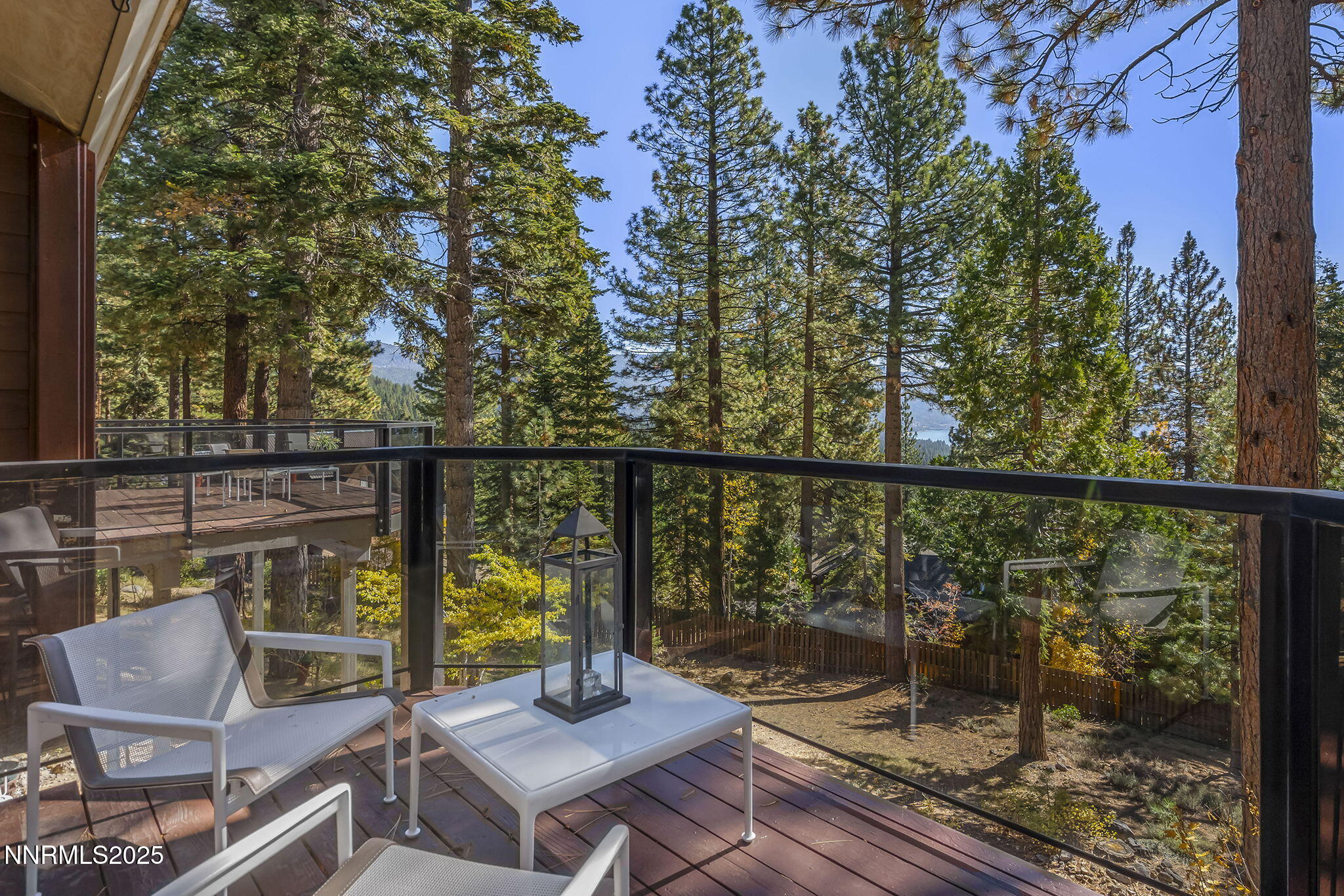 563 Tyner Way Incline Village, NV 89451 - Photo 38 of 42 a view of a balcony with chairs and wooden fence