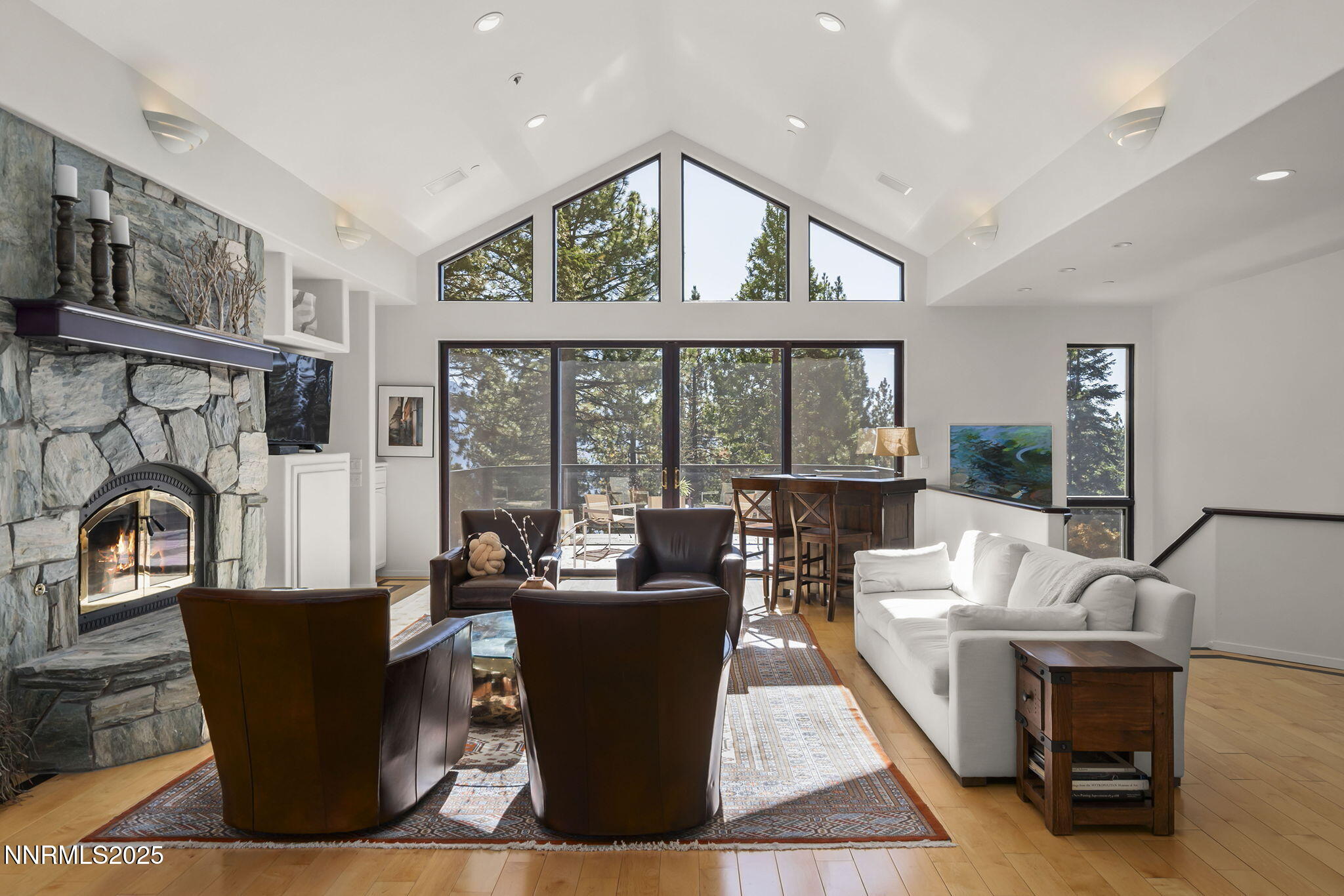 563 Tyner Way Incline Village, NV 89451 - Photo 4 of 42 a living room with furniture a large window and a fireplace