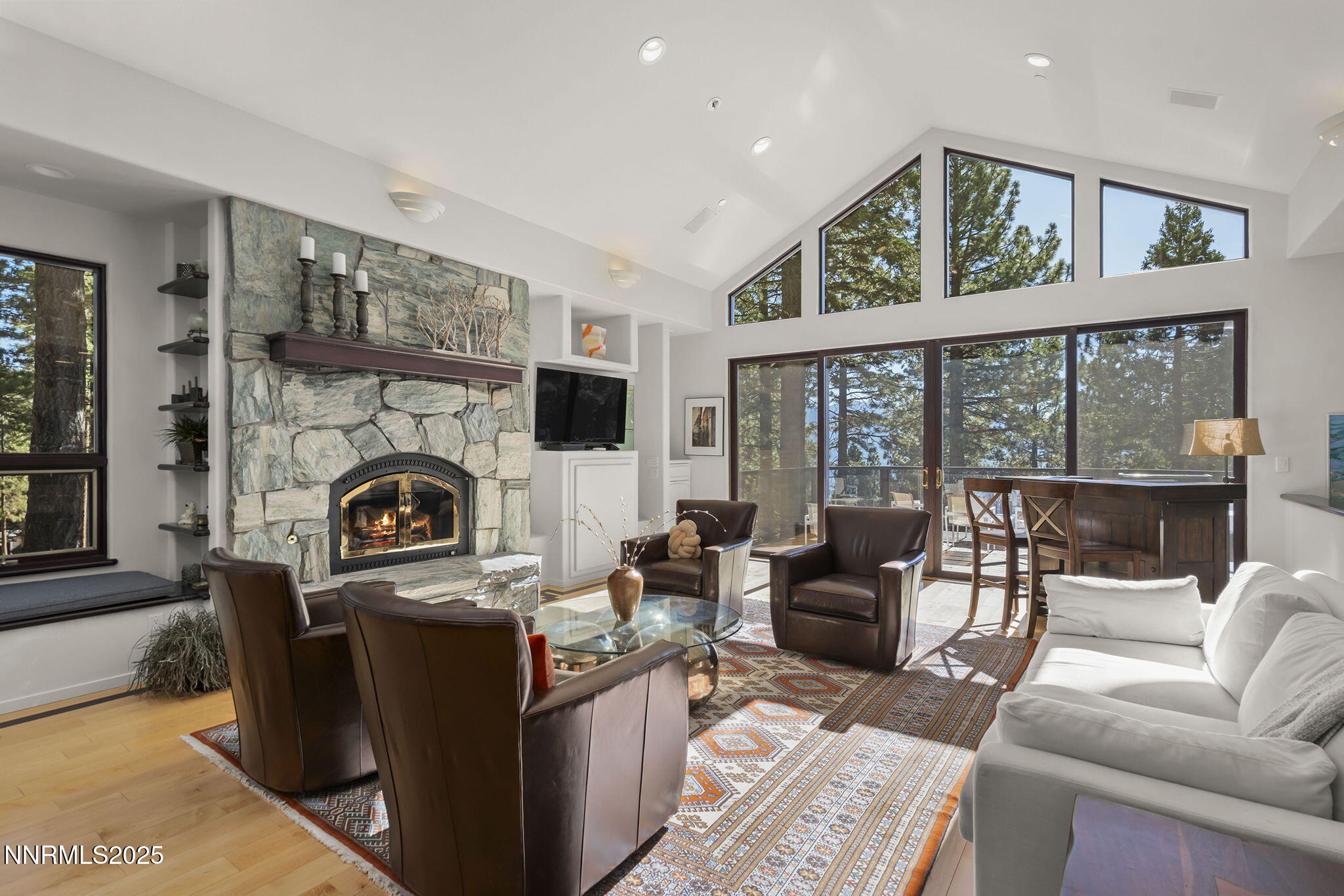 563 Tyner Way Incline Village, NV 89451 - Photo 5 of 42 a living room with furniture a large window and a fireplace
