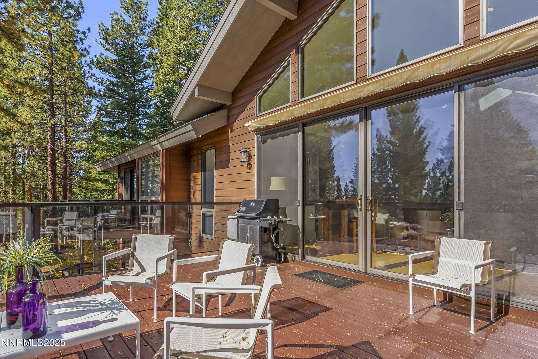 563 Tyner Way Incline Village, NV 89451 - Photo 9 of 42 a view of a patio with a table and chairs and potted plants
