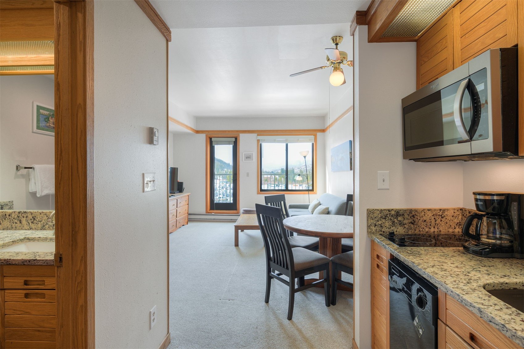 1211 West Keystone Road, Unit 2766 Keystone, CO 80435 - Photo 13 of 26 a kitchen with stainless steel appliances granite countertop a stove a sink and a microwave