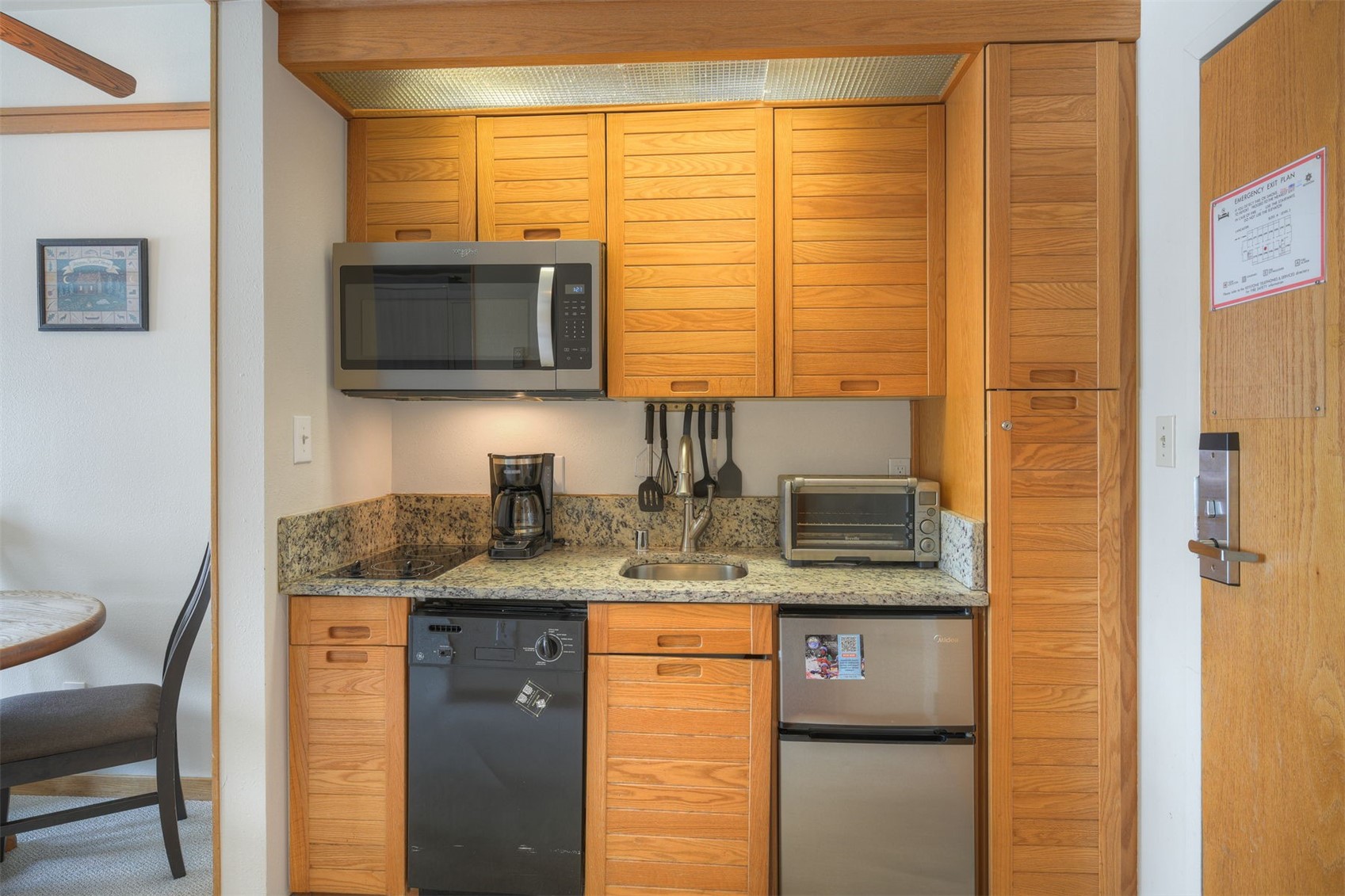 1211 West Keystone Road, Unit 2766 Keystone, CO 80435 - Photo 2 of 26 a kitchen with stainless steel appliances granite countertop a sink and a microwave