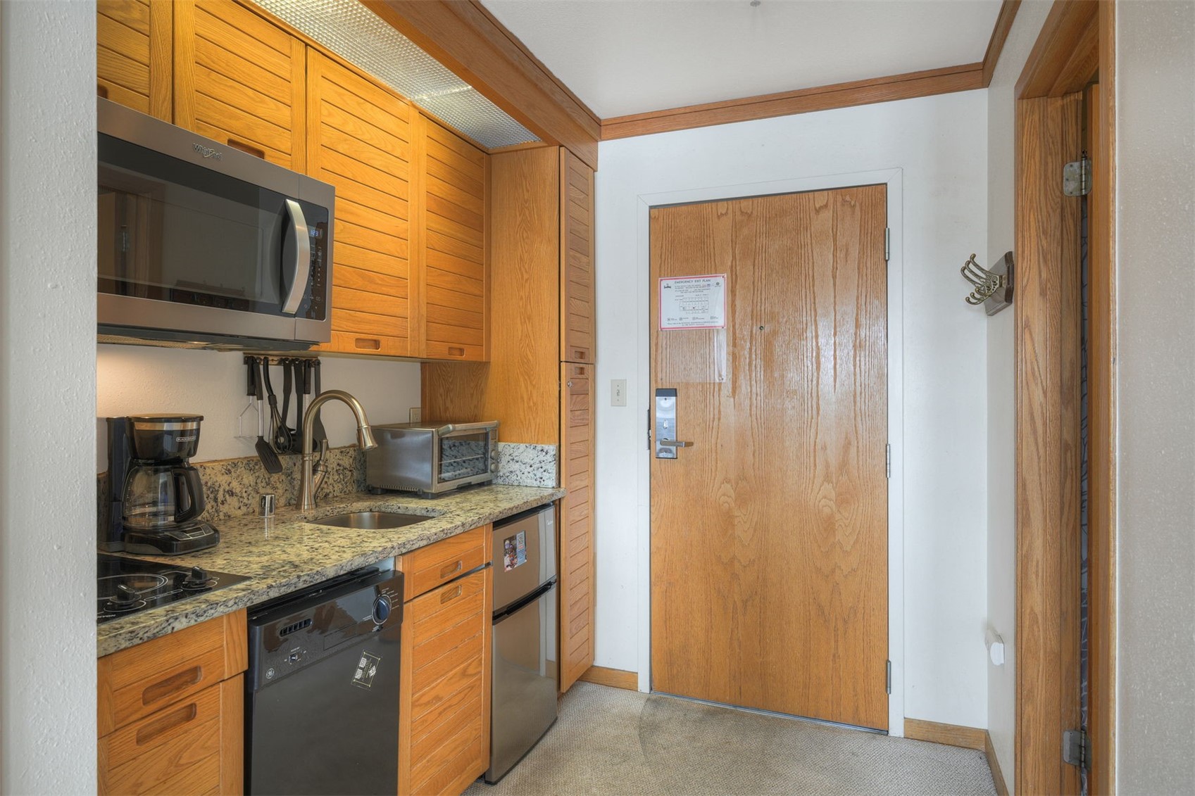 1211 West Keystone Road, Unit 2766 Keystone, CO 80435 - Photo 3 of 26 a kitchen with stainless steel appliances granite countertop a sink and a microwave