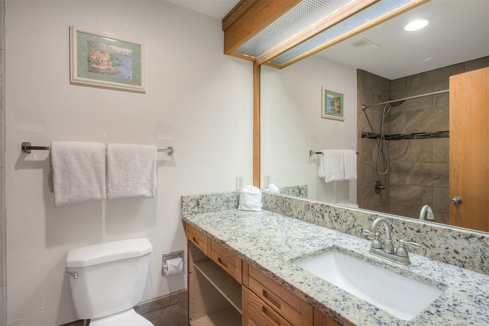 1211 West Keystone Road, Unit 2766 Keystone, CO 80435 - Photo 9 of 26 a bathroom with a granite countertop sink toilet and shower