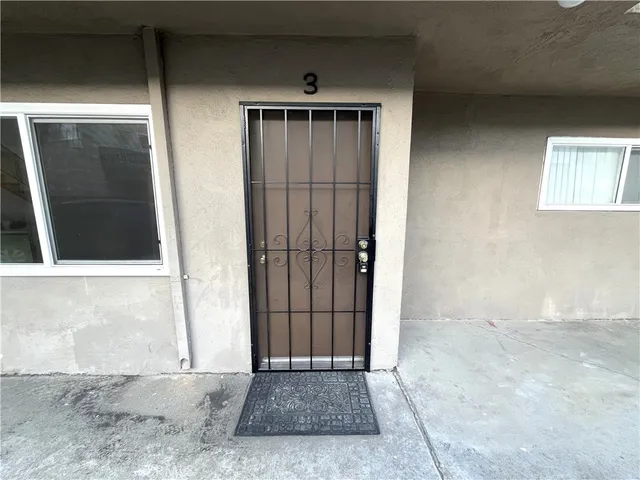 a view of a front door and a window