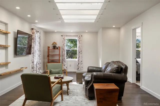 a living room with furniture and a window
