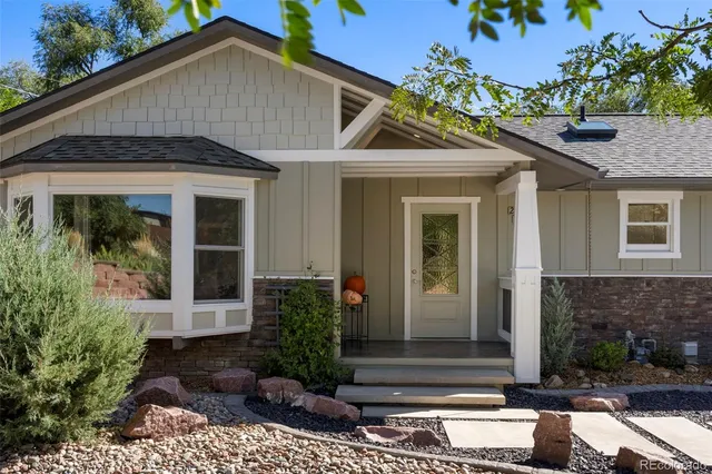 a front view of a house with garden