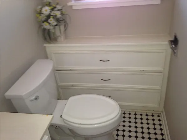 a bathroom with a toilet and a sink