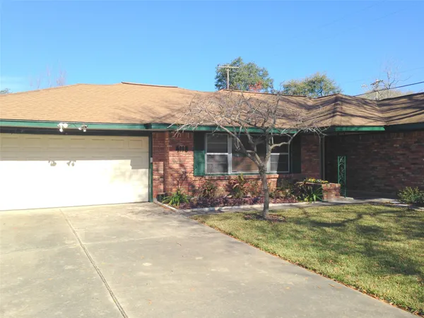 a view of a house with patio and yard