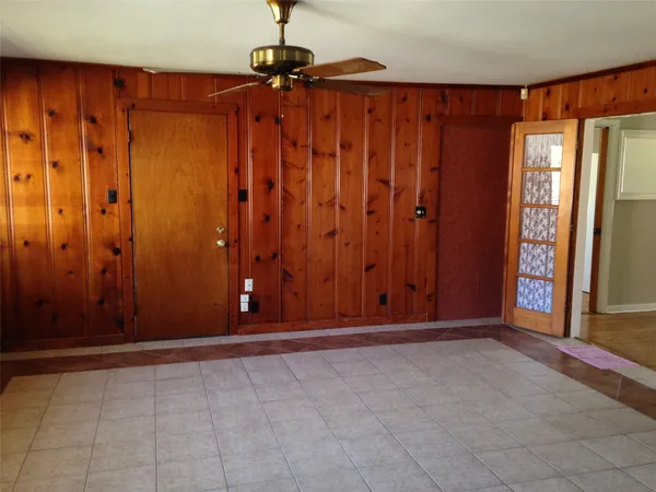 a view of a room with wooden walls