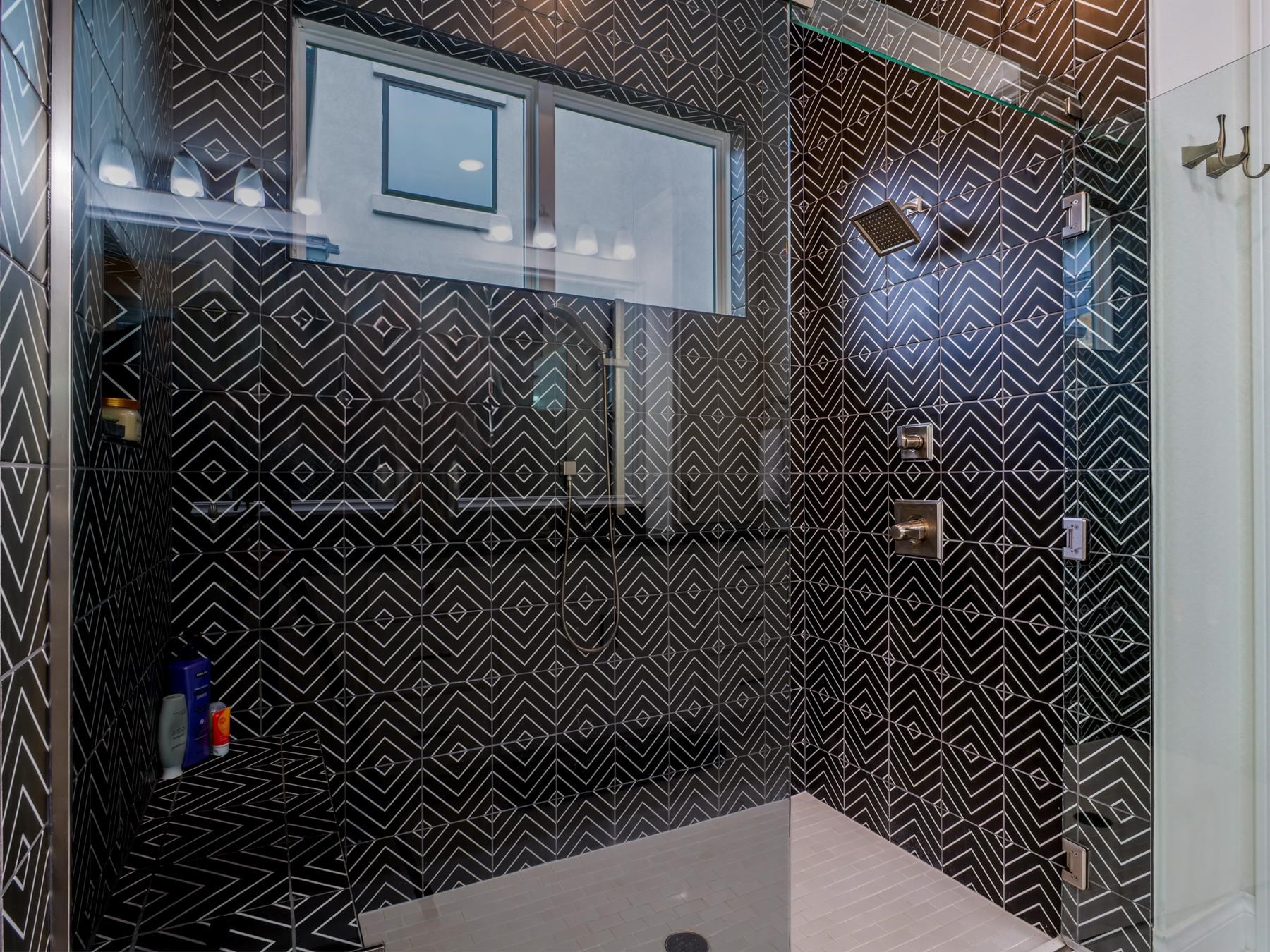 115 Rivalto Drive Horseshoe Bay, TX 78657 - Photo 12 of 29 a bathroom with a black white checkered floor