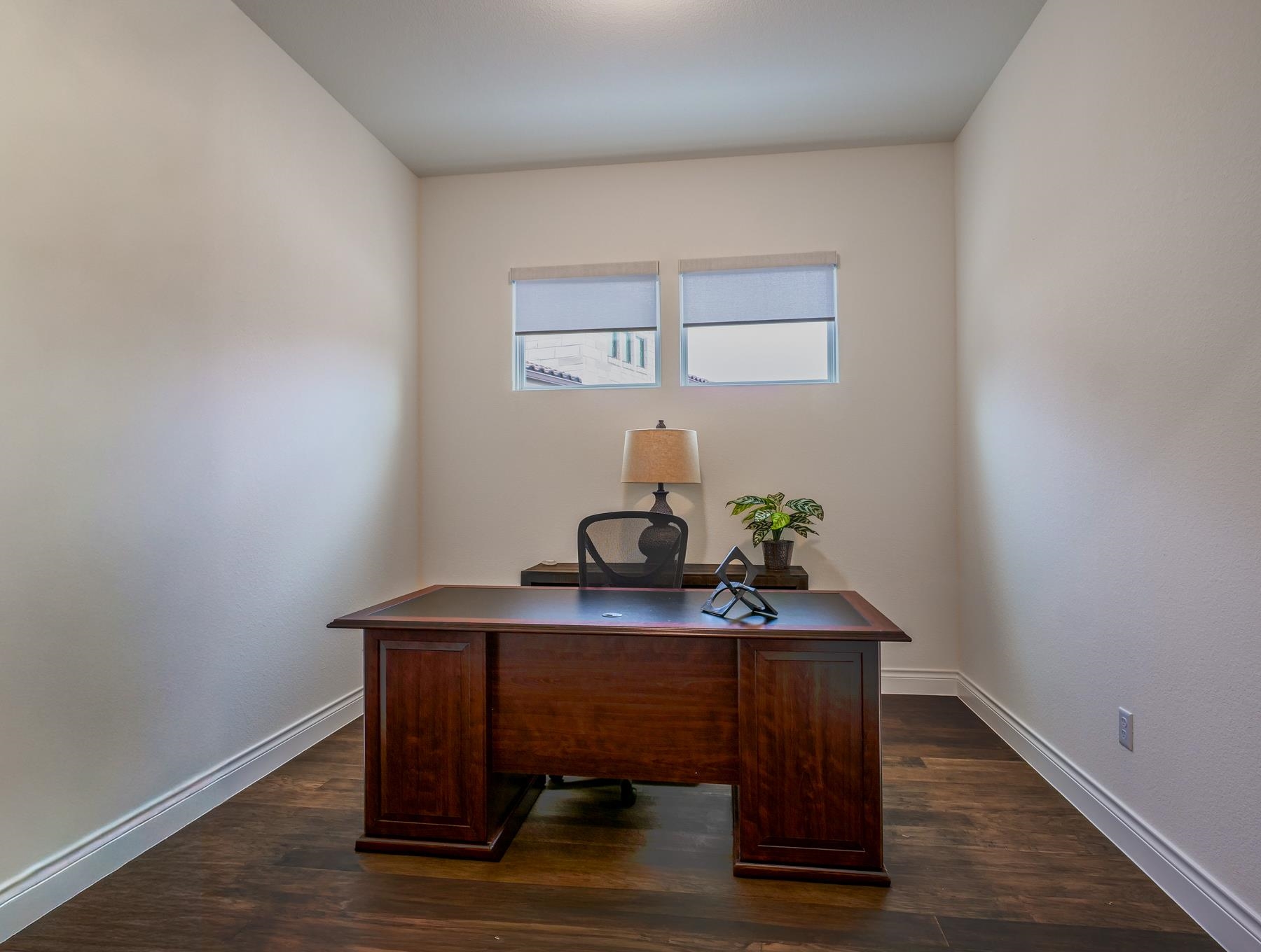 115 Rivalto Drive Horseshoe Bay, TX 78657 - Photo 16 of 29 a room with a table and potted plant