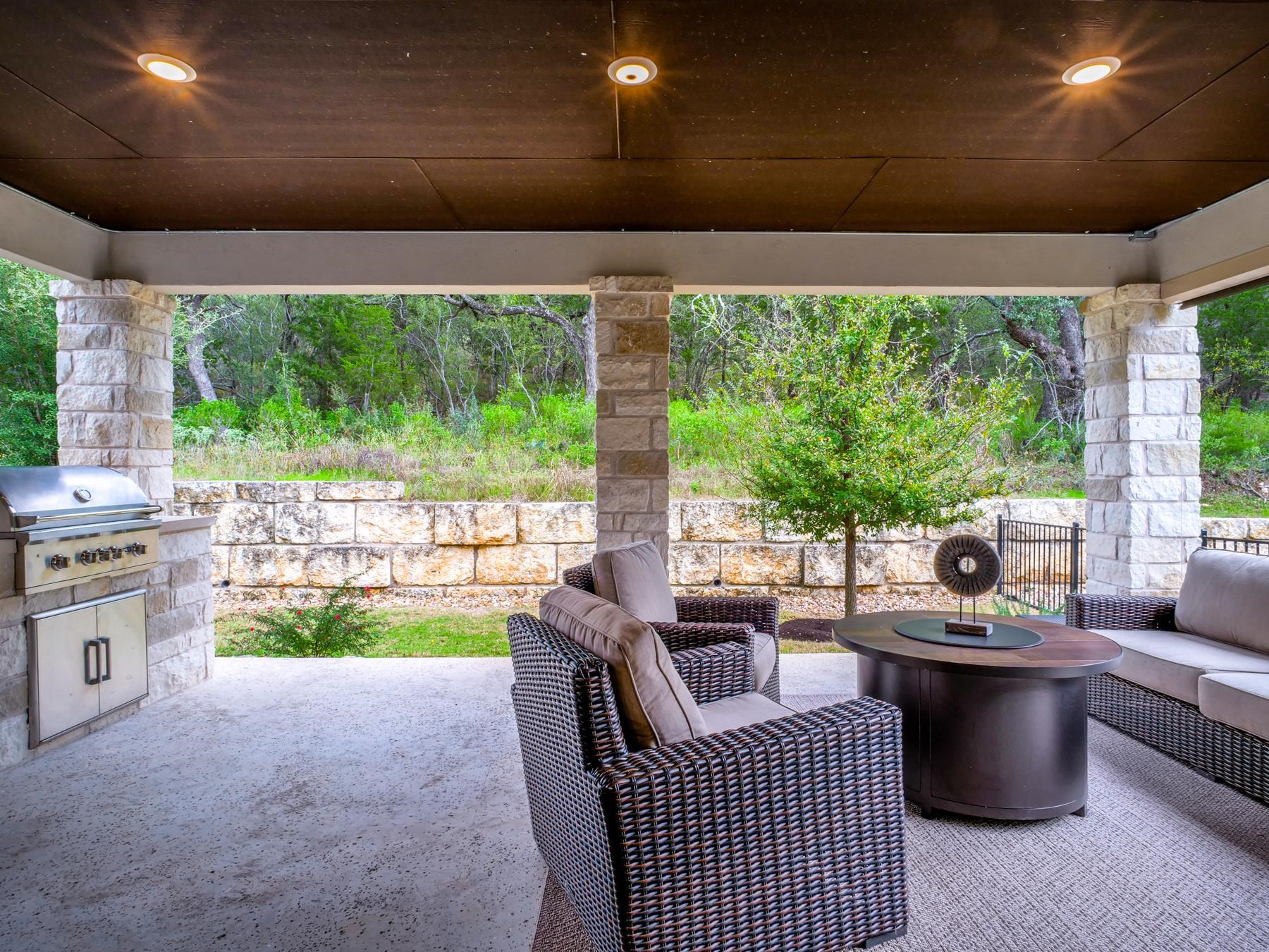 115 Rivalto Drive Horseshoe Bay, TX 78657 - Photo 25 of 29 a living room with furniture and a floor to ceiling window