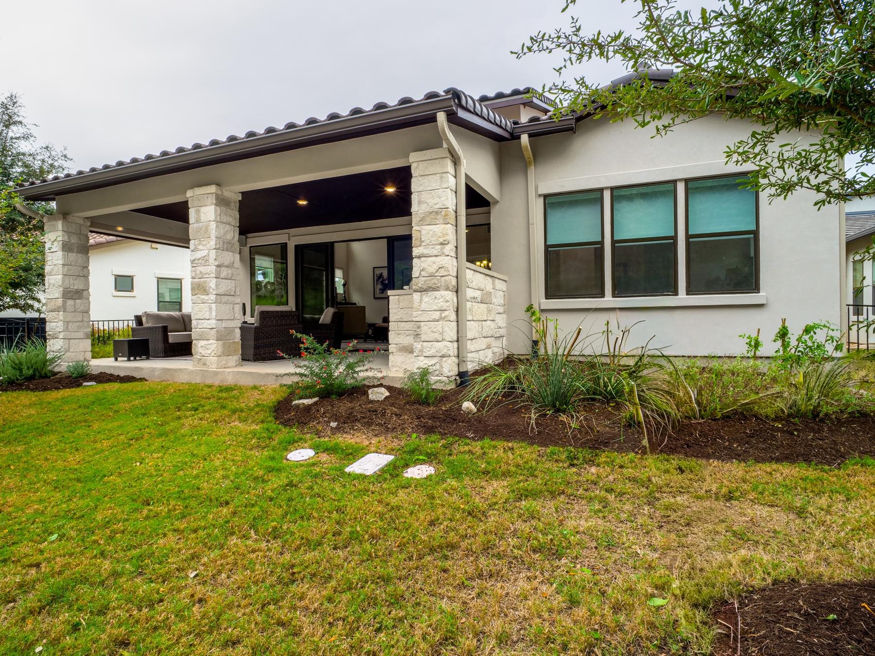 115 Rivalto Drive Horseshoe Bay, TX 78657 - Photo 27 of 29 a front view of a house with a yard