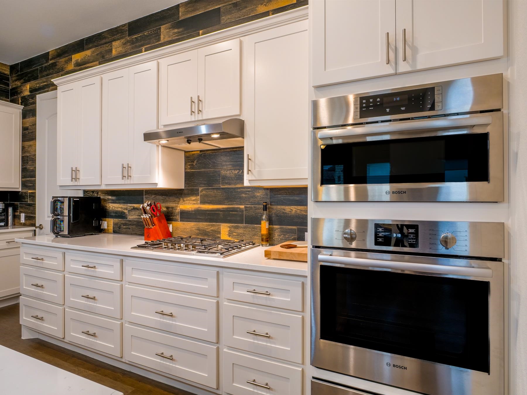115 Rivalto Drive Horseshoe Bay, TX 78657 - Photo 3 of 29 a kitchen with stainless steel appliances granite countertop white cabinets and a stove a oven with white countertops