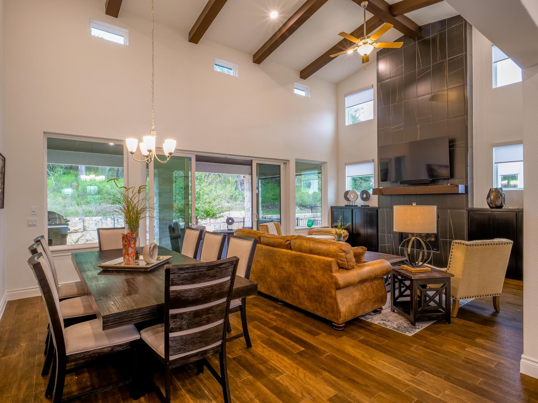 115 Rivalto Drive Horseshoe Bay, TX 78657 - Photo 5 of 29 a living room with fireplace furniture and a large window