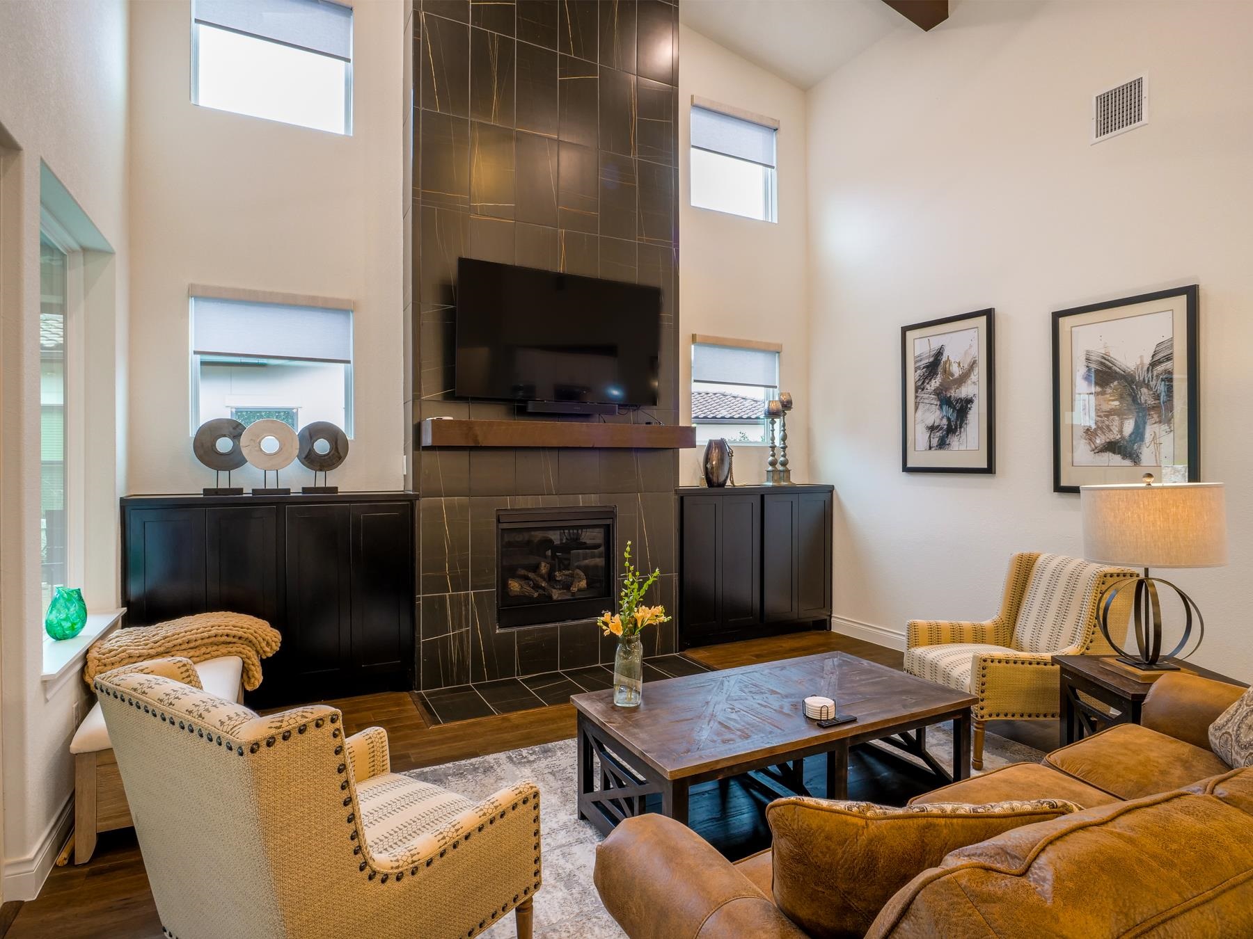 115 Rivalto Drive Horseshoe Bay, TX 78657 - Photo 7 of 29 a living room with furniture a flat screen tv and a fireplace