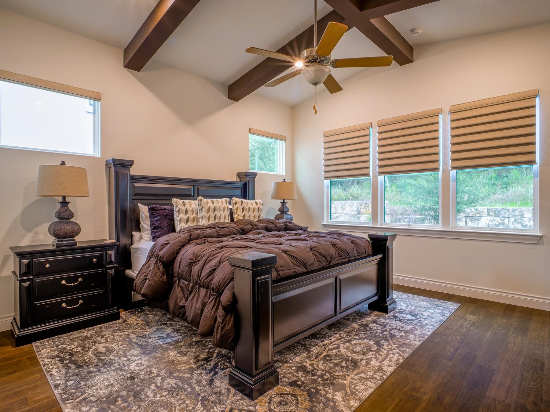 115 Rivalto Drive Horseshoe Bay, TX 78657 - Photo 9 of 29 a bedroom with a bed and a dresser