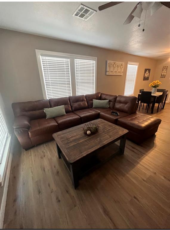 3209 North 23rd Street Waco, TX 76708 - Photo 2 of 8 a living room with furniture and wooden floor