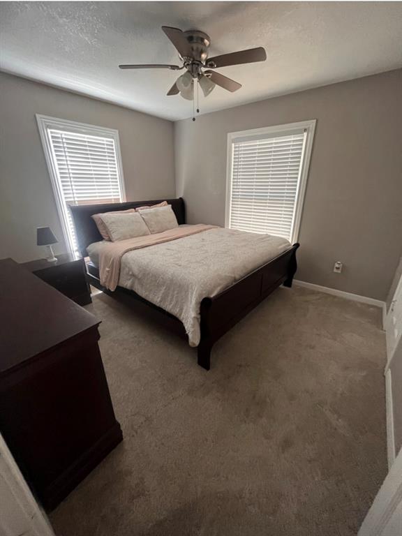 3209 North 23rd Street Waco, TX 76708 - Photo 4 of 8 a bedroom with a bed and window